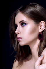 Beautiful woman with bright multicolor celebration make up Chic evening make-up. Fashion retouched portrait.