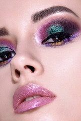 Beautiful woman with bright multicolor celebration make up Chic evening make-up. Fashion retouched portrait.