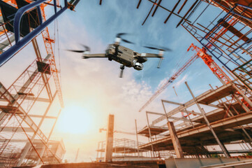 Fototapeta premium Drone over construction site. video surveillance or industrial inspection..