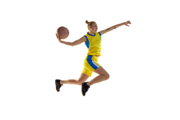 Fototapeta na wymiar Young girl in motion, throwing ball in jump, playing, training basketball against white studio background. Concept of professional sport, hobby, healthy lifestyle, action and motion