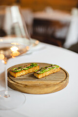 Appetizing bruschetta with anchovy and cucumber