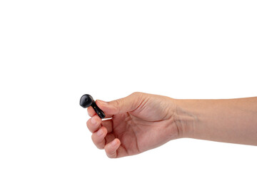 Wireless black bluetooth earphones in hand isolated close-up on a transparent background