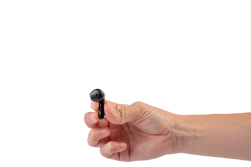 Wireless black bluetooth earphones in hand isolated close-up on a transparent background