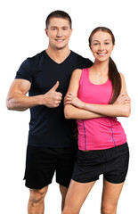 Young sportive couple on white background