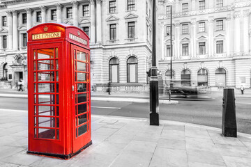 Fototapeta na wymiar London red telephone booth on city street.