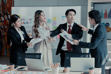 Businessperson is pressured by coworkers to do multitask in order to meet deadlines but feels overwhelmed and confused. Stress at work coupled with a lack of guidance and support from colleagues.