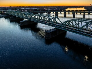 Drone shot of suspension bridge over river at sunrise in Trenton city, New Jersey