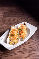 fresh western seafood steamed 2 big oyster shell with garlic ginger sauce in white plate on wood table luxury halal food fine dining restaurant menu