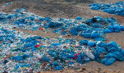 Plastic bottles and various garbage from hotels in the wild, Garbage dump in the desert in Egypt