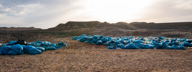 Plastic bottles and various garbage from hotels in the wild, Garbage dump in the desert in Egypt