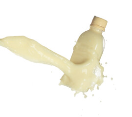 Tofu Soybean soymilk pour fall down in bottle container. Soybean milk or cosmetic cream moisturizer spill splash as paint color. White background isolated high speed shutter freeze motion