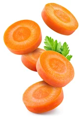 Poster Carrot slice isolated. Carrots with parsley flying on white background. Perfect retouched carrot slices isolate. Full depth of field. © Tim UR