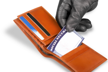 Hand in Glove Stealing a Social Security Card from a Wallet
