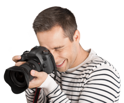 Young male photographer looking through camera