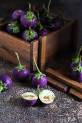 round purple eggplant on the table
