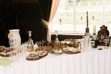 Delicious table of homemade rustic treats lard, meat, canned vegetables