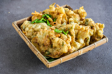 bakwan or bala-bala, Indonesian street food made from vegetables fritter, flour and deep fried until crunchy
