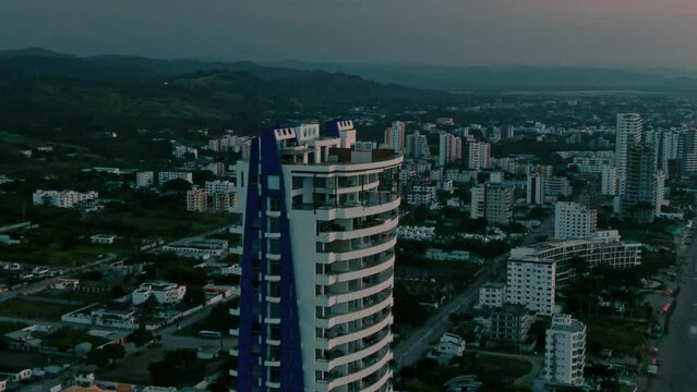 Aerial of Tonsupa beach and Grand Diamond Beach spa aparthotel at sunset in Ecuador.