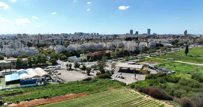 Aerial footage of the skyline of the northern city of Kfar Saba. Filmed in C4K Apple ProRes 422 HQ