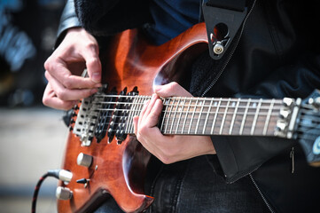 musician on the street with electric guitar