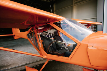 Photo of a small orange airplane for 2 people details