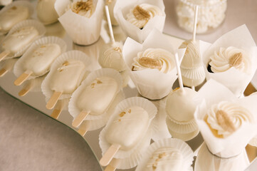 white cake and candy bar for baby's baptism