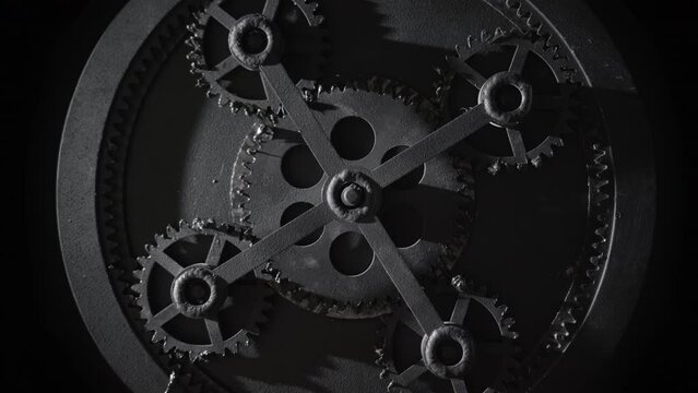 Process of mechanism of five rotating gears work from inside. Old black moving engine construction. Steampunk vintage, task operation, waiting concept