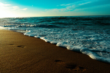 CINEMATIC FOOTSTEP NEAR FOAM SUNRISE BEACH SAND