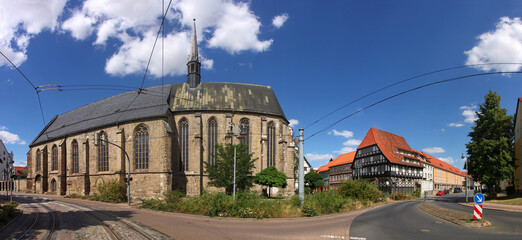 Obraz premium Panoramic view of the gothic St. Katharinen monastery church and a half-timbered house in the old town of Halberstadt, Germany