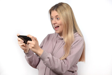 pretty cute young woman playing game on phone
