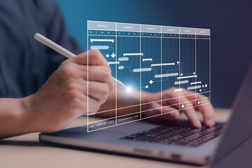 Project management concept. Site manager working with Gantt chart schedule for plan tasks and progress. Planning software. Corporate strategy for construction, finance, operations, sales, marketing.