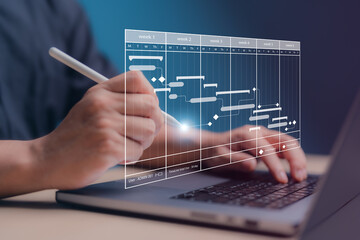 Project management concept. Site manager working with Gantt chart schedule for plan tasks and...