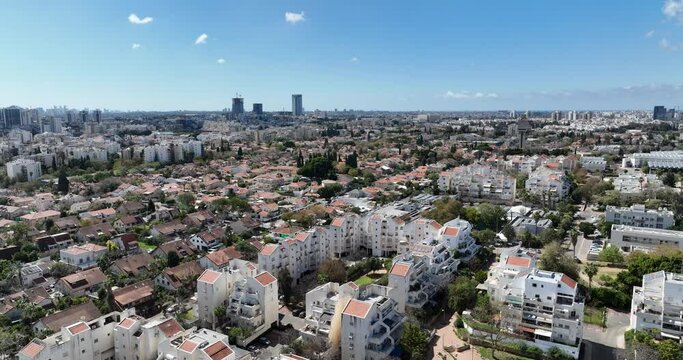 Aerial footage of the skyline of the northern city of Kfar Saba. Filmed in C4K Apple ProRes 422 HQ