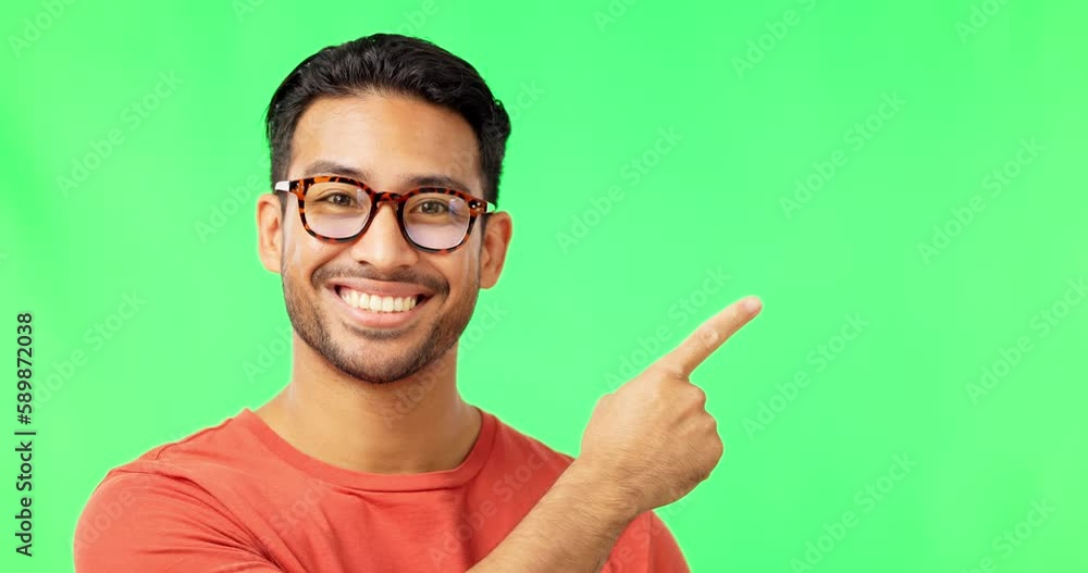 Poster face, advertising and pointing with a man on a green screen background in studio for marketing or pr