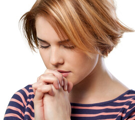 Portrait of a young woman praying