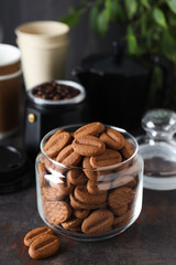 Concept of tasty snack for hot drink - cookies in the shape of coffee seeds