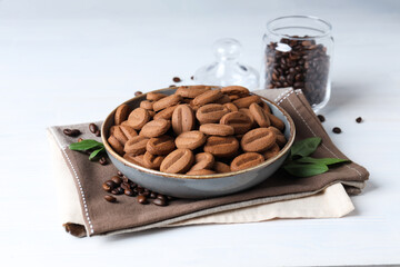 Concept of tasty snack for hot drink - cookies in the shape of coffee seeds