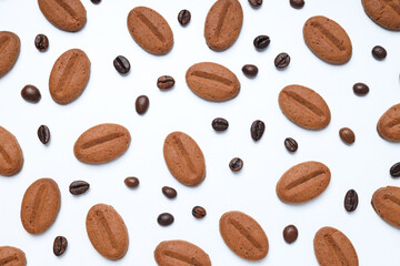 Concept of tasty snack for hot drink - cookies in the shape of coffee seeds