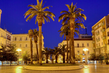 Fototapeta na wymiar View of Maria Immacolata Square (Piazza Maria Immacolata) of Taranto at the first light of dawn. Puglia, Italy