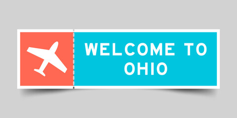 Orange and blue color ticket with plane icon and word welcome to ohio on gray background