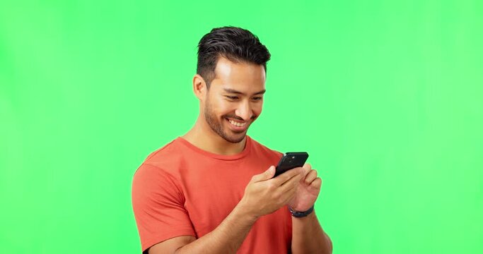 Happy, search and phone with asian man on green screen for social media, technology or website. Internet, app and online news with male and text message on studio background for smile, mobile or chat