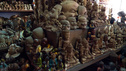 Face mask souvenirs, Hindu and Buddhist wooden carving. souvenir shop selling souvenirs and handicrafts of Bali at famous Ubud Market, Indonesia