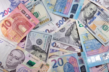 Set of one hundred dollars banknotes euro hryvnia 500, 200 Uah Money and save concept Benjamin Franklin Paper money currency cash Finance payments close-up Free space for your text Credit concept