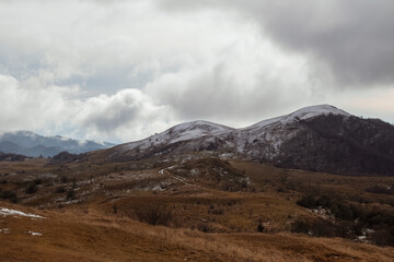 Fototapeta na wymiar Caucasian mountains in the clouds