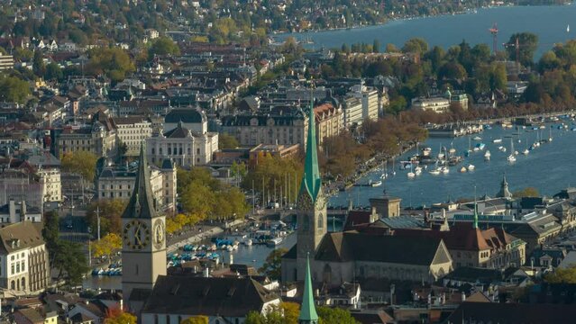 sunny day flight over zurich city center famous church towers aerial panorama 4k timelapse switzerland 