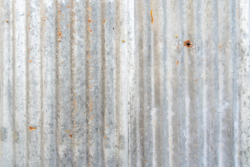 The Rusty zinc sheet texture and background, Reddish brown stain on metallic silver