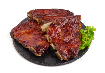 Roasted Pork Ribs with herbs, isolated on a white background. Close-up.