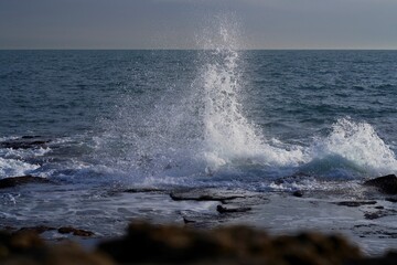 Waves break on a rocky coast