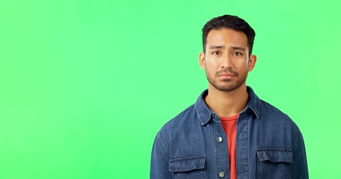 Man, sad and portrait on green screen while shaking head for feedback, fail or no. Face of asian male model with bad news or negative review and rating mockup space on studio background or chroma key