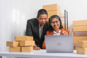 Confident elderly Asian businessman and female husband and wife in formal suit working as SMEs deliver parcels online. They are social media influencers with huge followings, long real true love.
